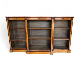 A large Victorian style satinwood dwarf open bookcase