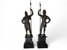 A pair of late 19th century Italian patinated bronze spelter figures of medieval knights on marble b