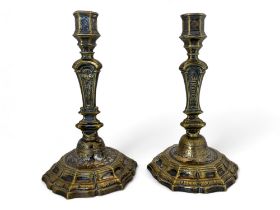 A closely matched pair of French Regence style silvered brass candlesticks, probably early 18th cent