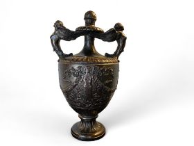A large early 20th century terracotta classical twin handled urn with a metallic bronzed glaze
