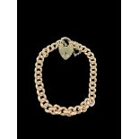 A 9ct gold graduated curblink bracelet with 9ct gold heart padlock clasp