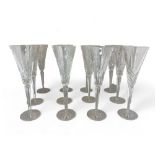 A set of nineteen Waterford Crystal cut glass champagne flutes / glasses