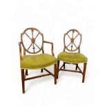 Cesinsky illustrated: A set of eight George III birch dining chairs including a pair of open armchai