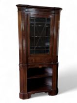 A mahogany and boxwood inlaid corner cupboard, late 18th century and later