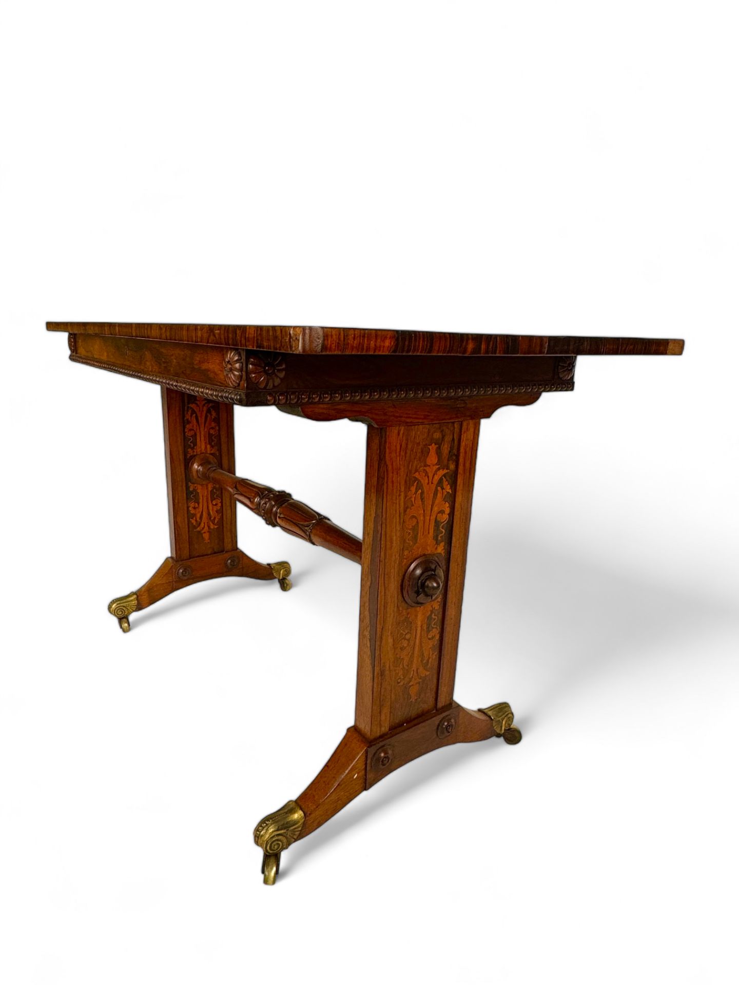 A Regency gonçalo alves and sycamore marquetry library table