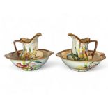 A pair of late 19th century Royal Doulton Art Nouveau pitchers and bowls