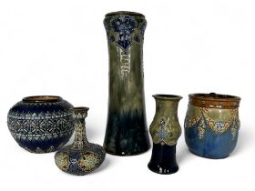 A group of Royal Doulton vases and a tobacco jar