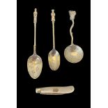 Two silver caddy spoons, another caddy spoon and a silver and mother-of-pearl fruit knife