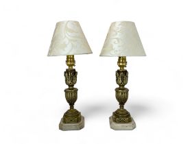 A pair late 19th /early 20th century French small gilt brass candlesticks converted to table lamps