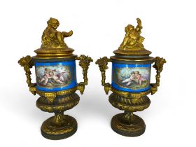 A pair of 19th century French gilt bronze mounted Sevres style turquoise glazed porcelain urns and c