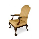 A George II carved mahogany library open arm chair