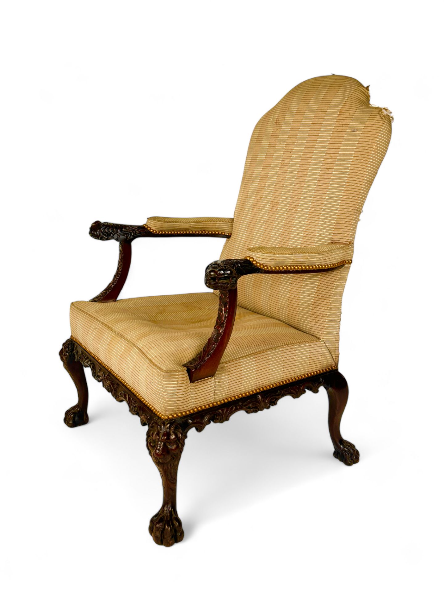 A George II carved mahogany library open arm chair