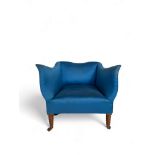 A late 19th century shaped upholstered tub chair upholstered in Colefax & Fowler blue fabric