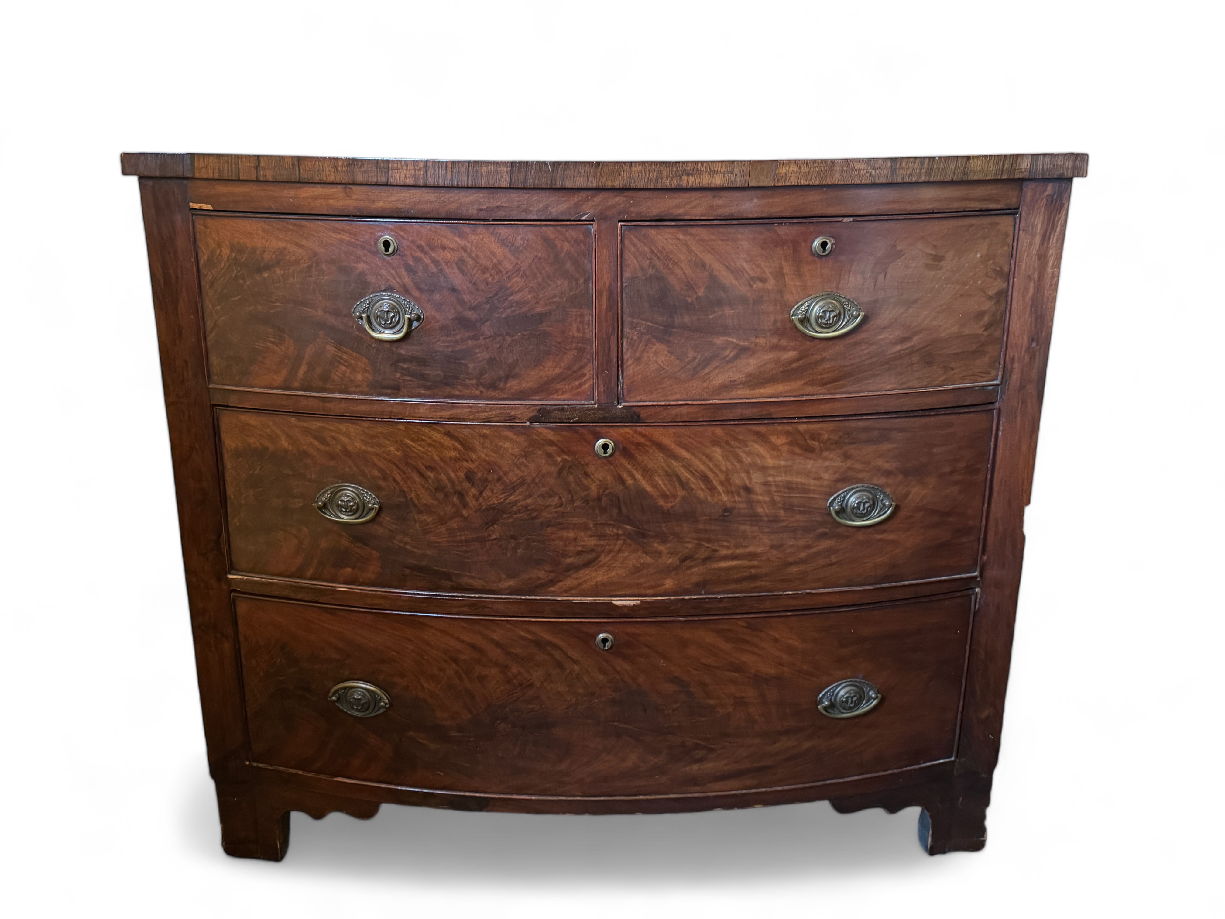 A Regency mahogany and rosewood crossbanded bow front chest