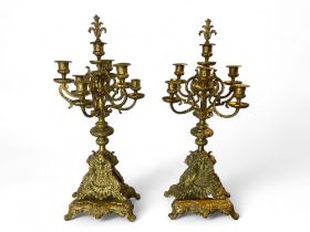 A pair of late 19th century Louis XIV style gilt metal six light candelabra