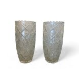 A pair of heavy cut glass flower vases