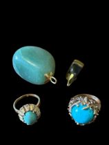 Two turquoise and yellow metal rings