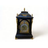 A late 19th century German ebonised and gilt metal mounted bracket clock and bracket by Winterhalder
