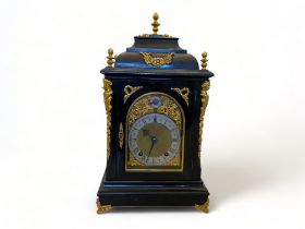 A late 19th century German ebonised and gilt metal mounted bracket clock and bracket by Winterhalder