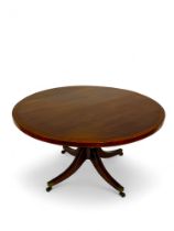 A George III mahogany and satinwood banded circular breakfast table