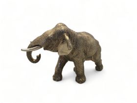 A silver model Asian elephant in walking pose, Carrs of Sheffield Ltd, Sheffield,1999