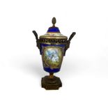 A 19th century Sèvres style porcelain and gilt bronze mounted beau bleu cup and cover