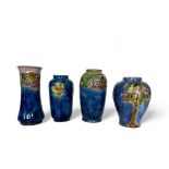 Four various Royal Doulton tube-lined vases