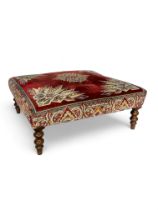 A large 19th century style flock tapestry covered footstool