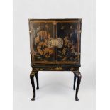 An early 18th century Chinese export black lacquer cabinet on a European stand