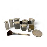 A group of silver and glass dressing table pots, silver compact and a cased bakelite vanity set