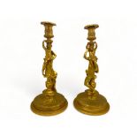 A pair of large 19th century French ormolu candlesticks in the manner of Corneille Van Cleve (French