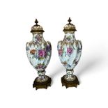 A pair of late 19th century Frankenthal gilt bronze mounted and floral decorated vases and c