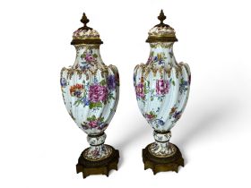 A pair of late 19th century Frankenthal gilt bronze mounted and floral decorated vases and c