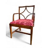 A provincial George III mahogany open armchair