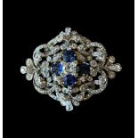 A 19th century sapphire and diamond scroll brooch / pendant, c.1880