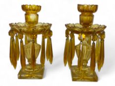A pair of 19th century amber cut glass table lustres