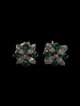 A pair of diamond and green stone cluster stud earrings