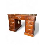 A small late Victorian mahogany pedestal desk