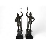 A pair of late 19th century Italian patinated bronze spelter figures of medieval knights on marble b