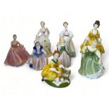 A collection of porcelain ladies by Royal Doulton, Coalport and Royal Worcester
