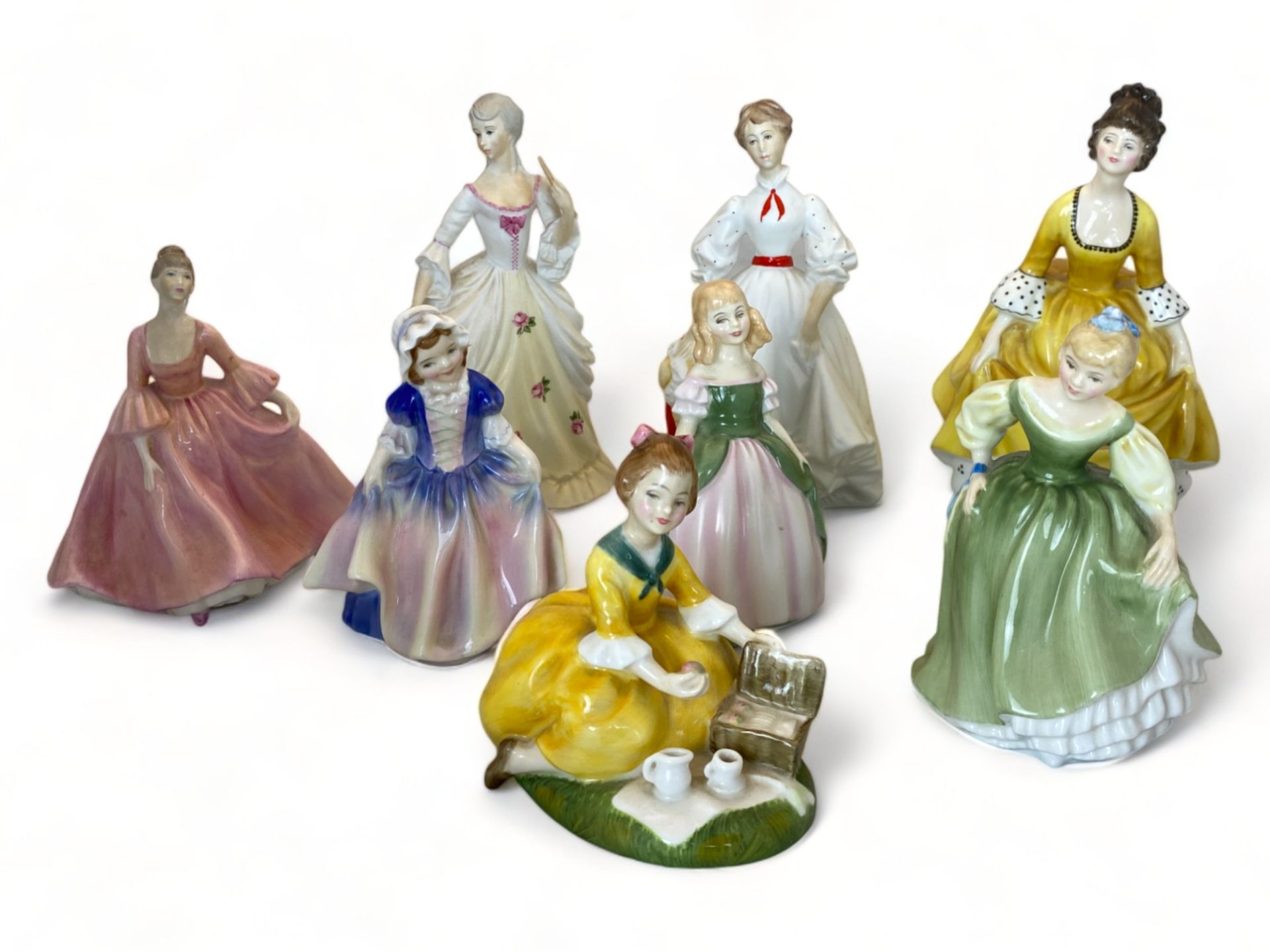 A collection of porcelain ladies by Royal Doulton, Coalport and Royal Worcester