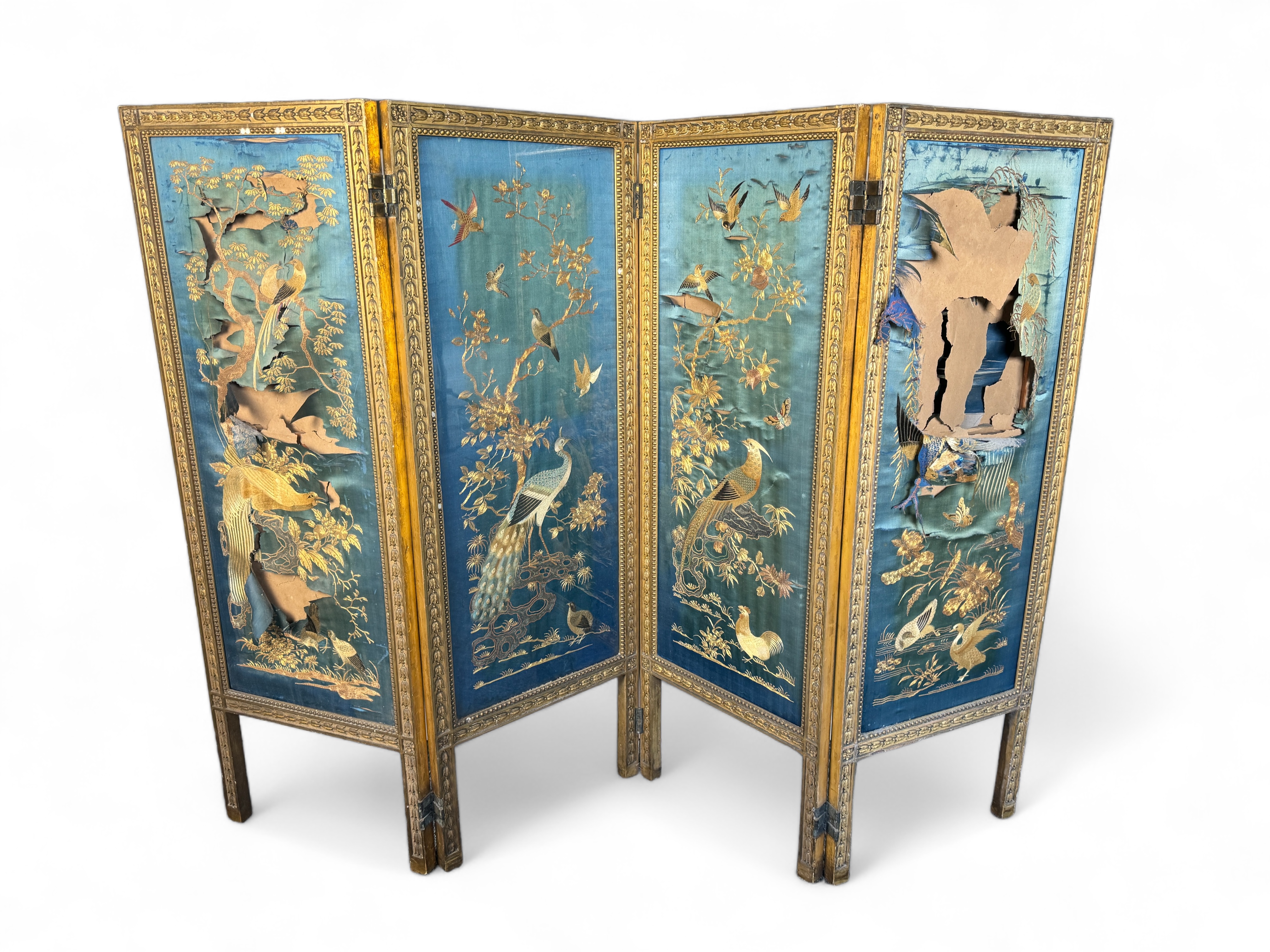 A 19th century French Louis XVI style four fold giltwood screen with panels of Chinese silk embroide