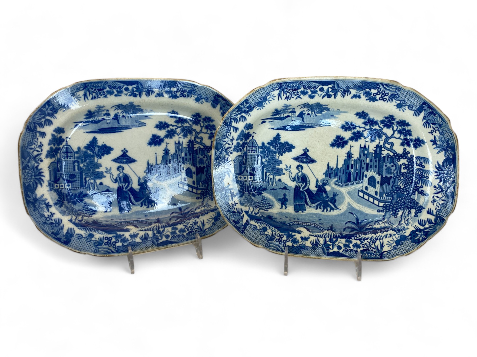 A pair of early 19th century Minton Queen of Sheba pattern blue and white transfer decorated meat pl