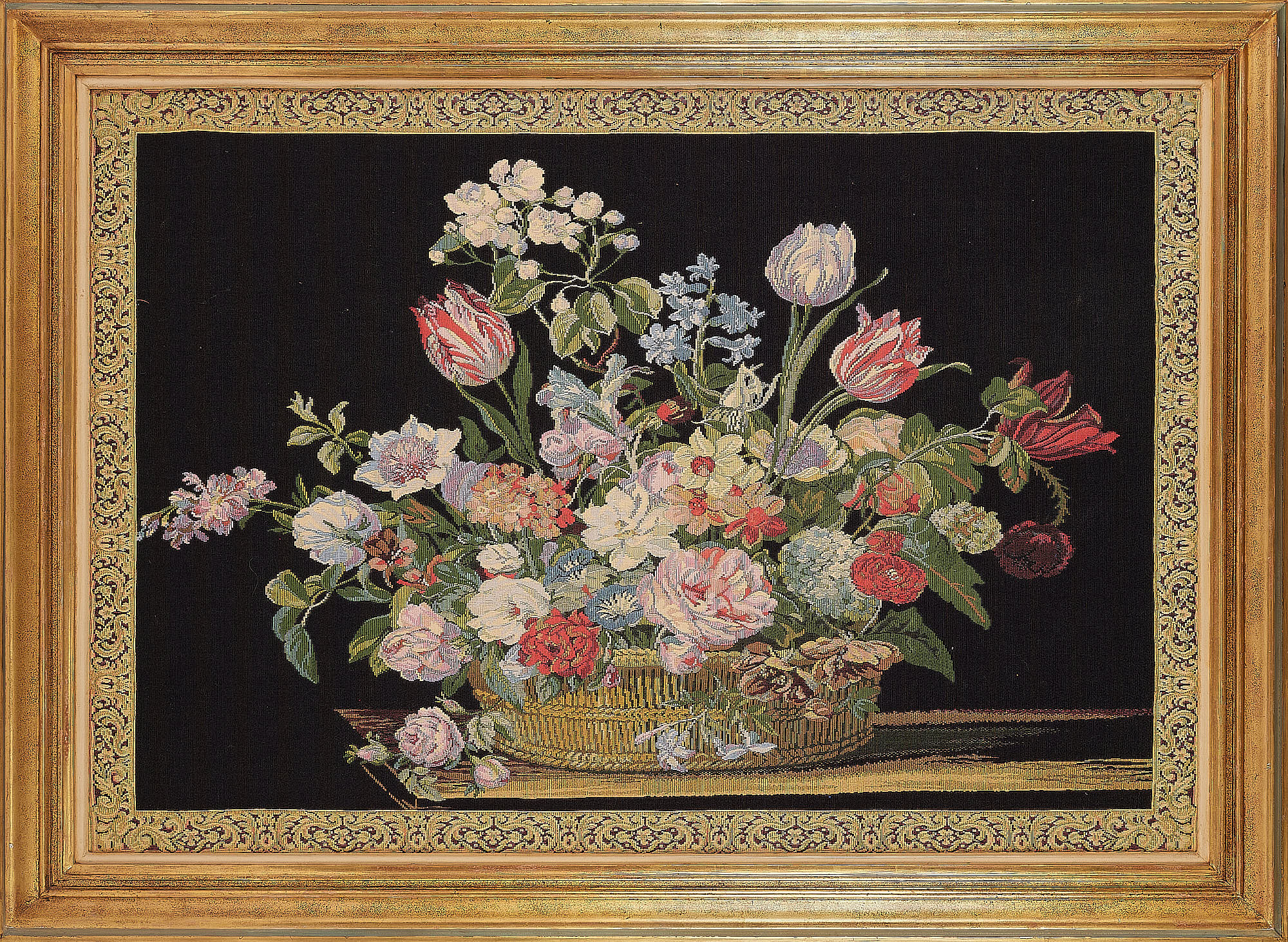 A large Belgian Metrax tapestry depicting a still life of a vase of flowers