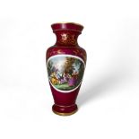 A large late 19th /early 20th century French Louis XVI style cerise glazed and gilt porcelain vase