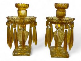 A pair of 19th century amber cut glass table lustres