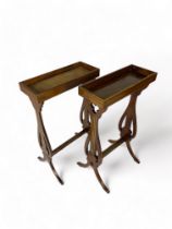 A matched pair of French Empire style mahogany and brass inlaid vide poches