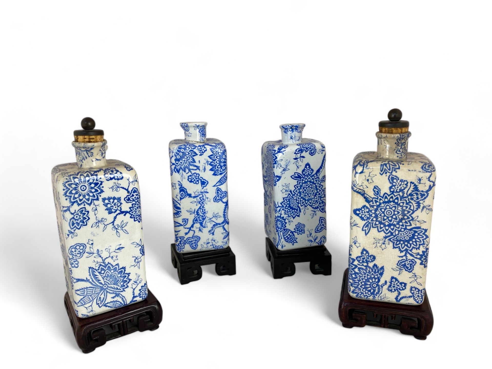 Two pairs of Liberty's blue and white foliate transfer printed bottles on Chinese hardwood stands - Image 3 of 7