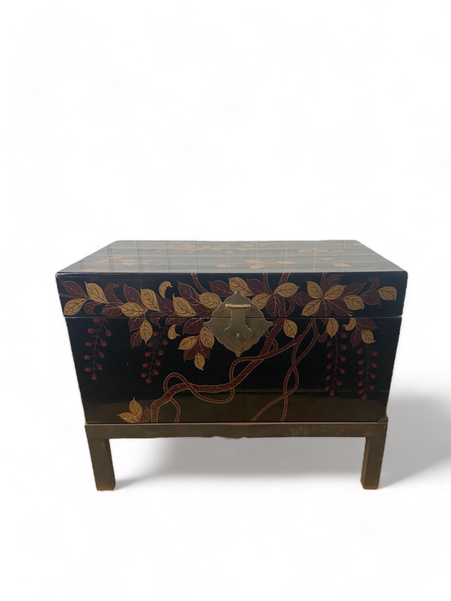 A 20th century Chinese black and gilt lacquer box on a metal stand