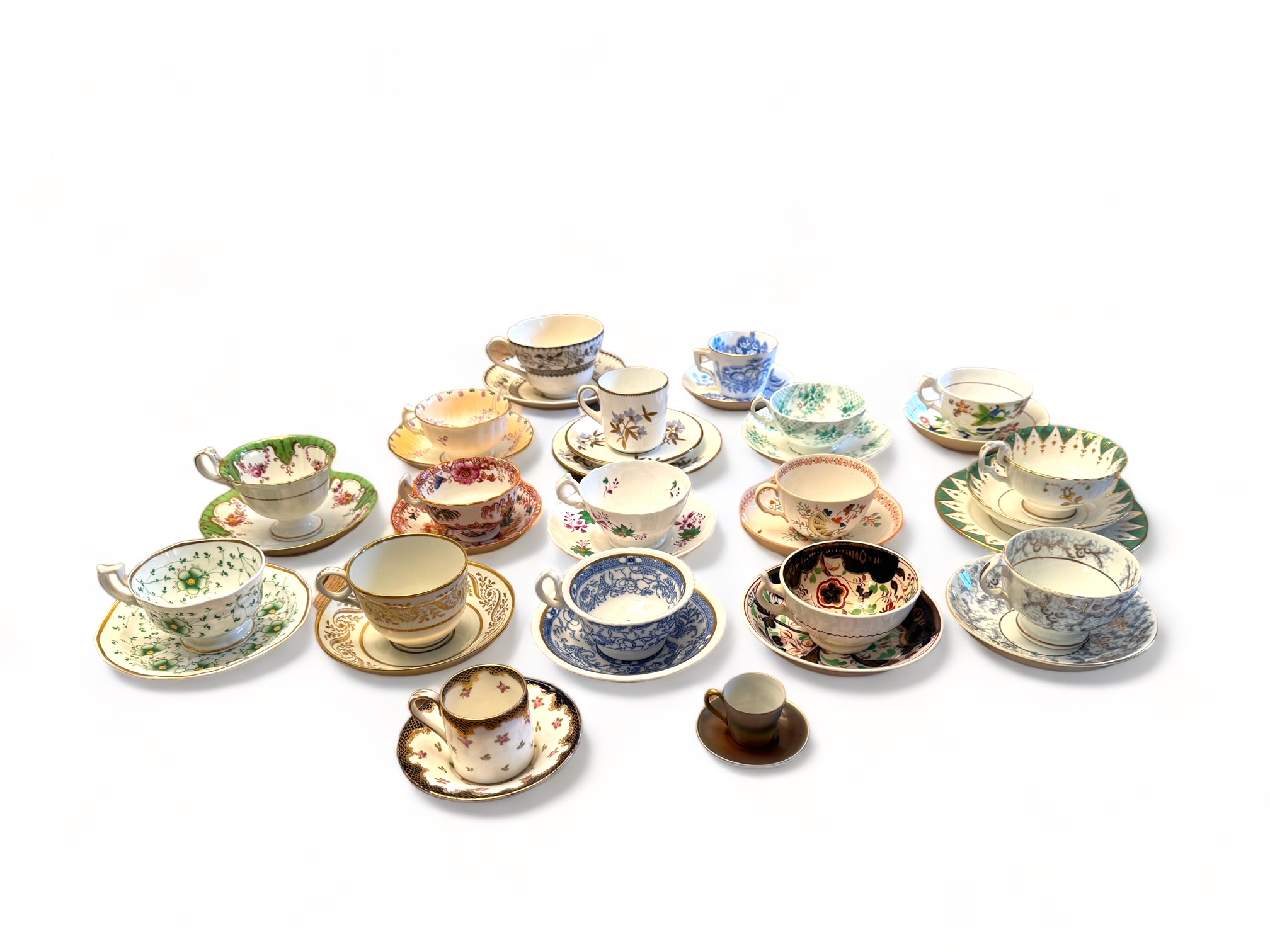 A collection of eighteen largely mid 19th century English porcelain cups and saucers